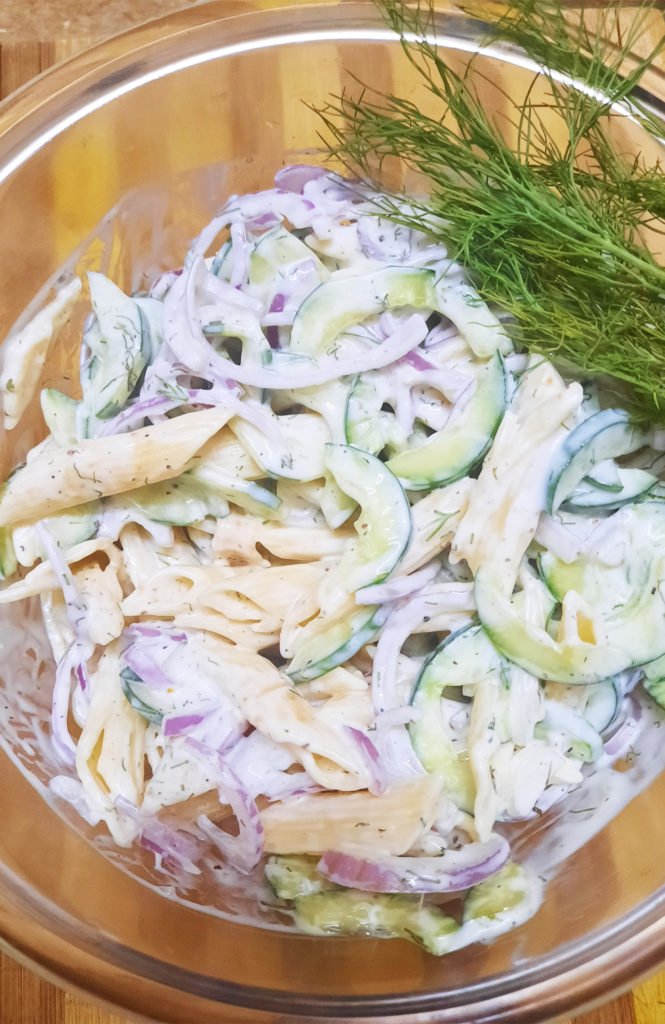 This quick and easy Creamy Cucumber Pasta Salad combines a creamy dressing - like a mixture of Greek yogurt or sour cream - with freshly sliced cucumbers and red onions along with plenty of chopped dill! It's the perfect unique pasta salad recipe for your next backyard barbecue.